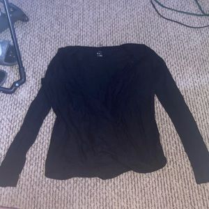 A black long sleeve cross cross shirt. Unworn.